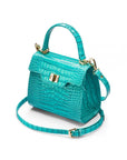 Mini leather Morgan Bag, top handle bag, turquoise croc, side view