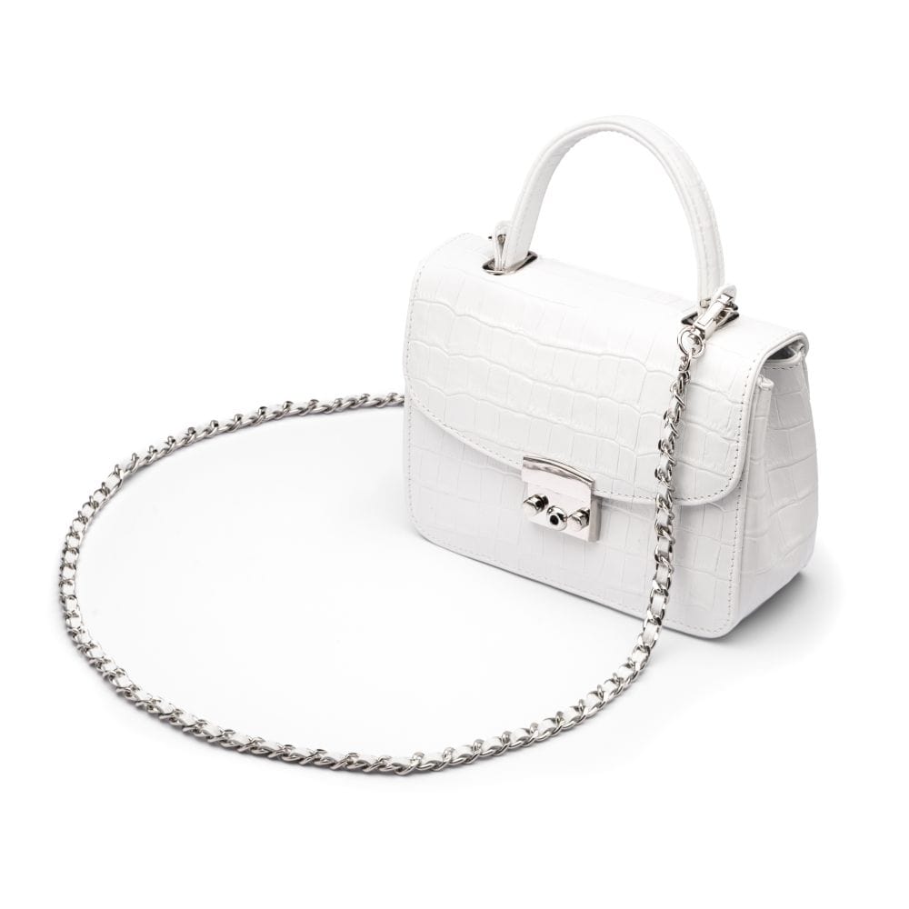Small leather top handle bag, white croc, side