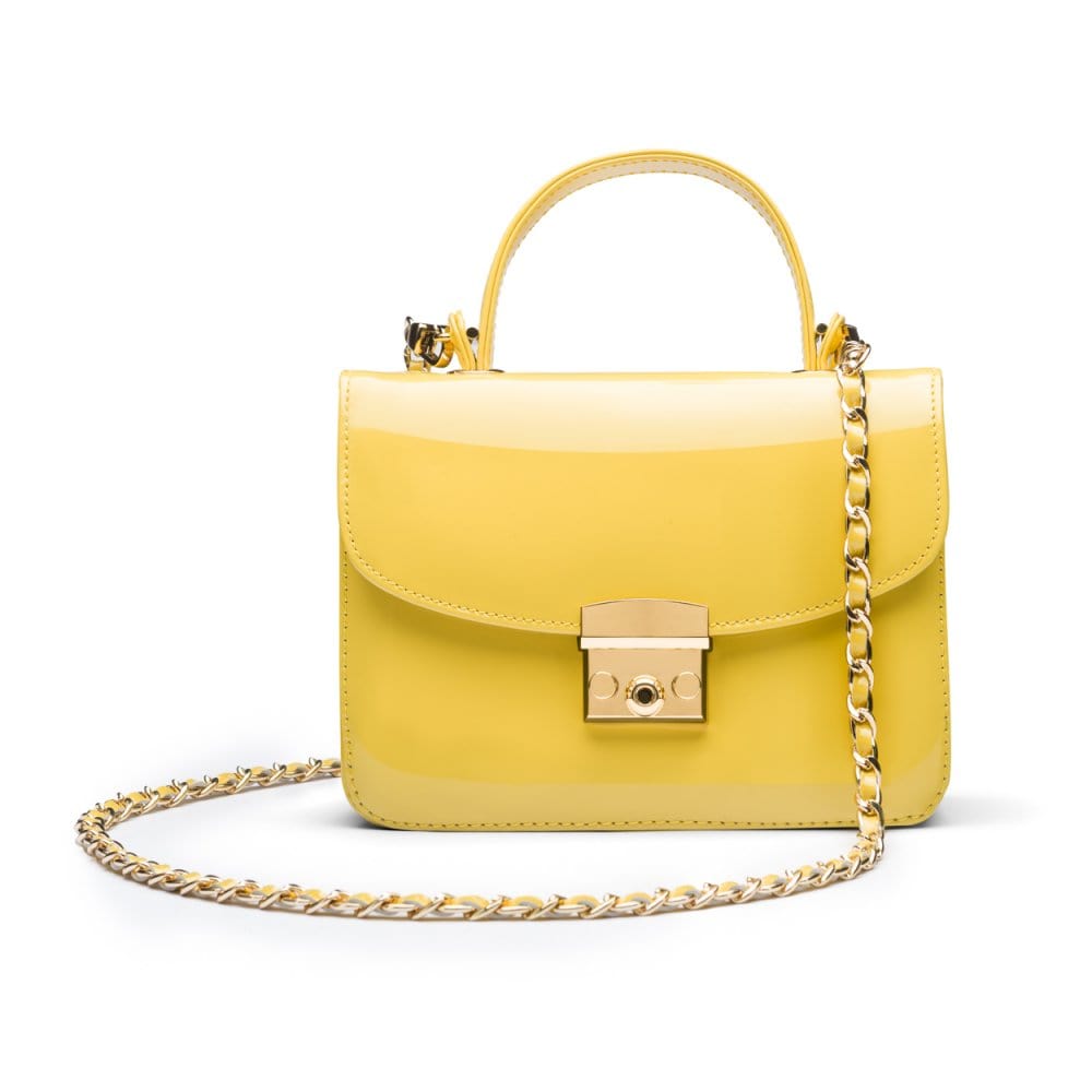 Small leather top handle bag, yellow patent, with chain strap