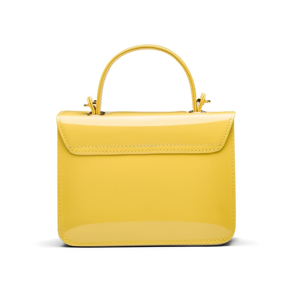 Small leather top handle bag, yellow patent, back