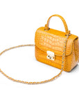 Small leather top handle bag, yellow croc, side