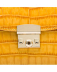 Small leather top handle bag, yellow croc, lock close up