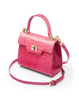 Mini leather Morgan Bag, top handle bag, pink croc, side view