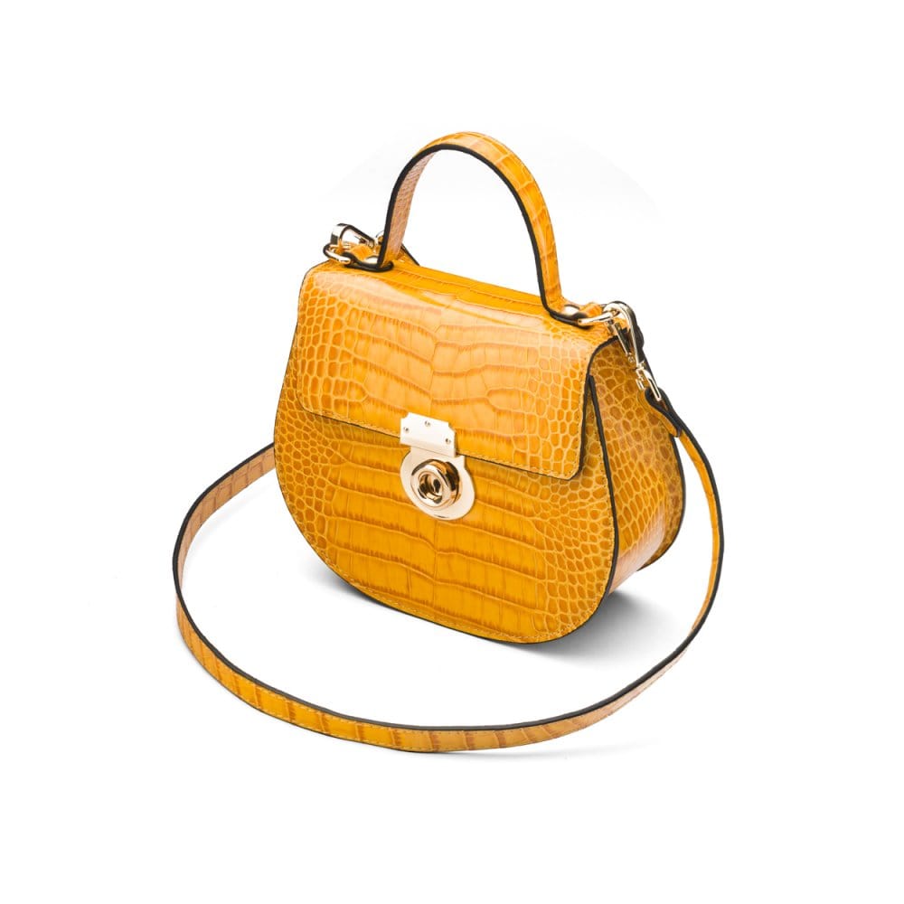 Leather rounded bottom top handle bag, yellow croc, side