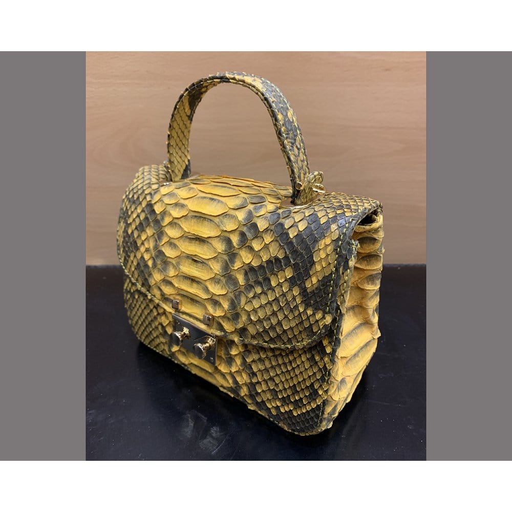 Small real python top handle bag, yellow, side